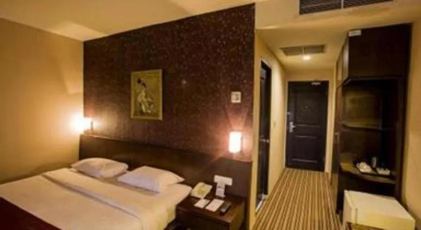 Bed in Kenari Tower Hotel