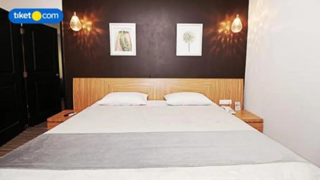 Bed in Kenari Tower Hotel