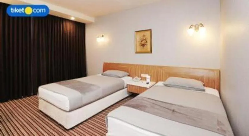 Bed in Kenari Tower Hotel