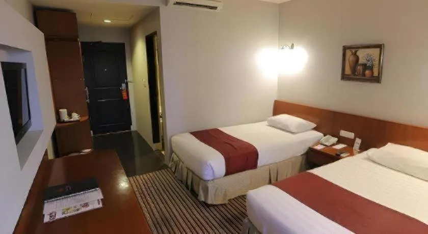 Bed in Kenari Tower Hotel