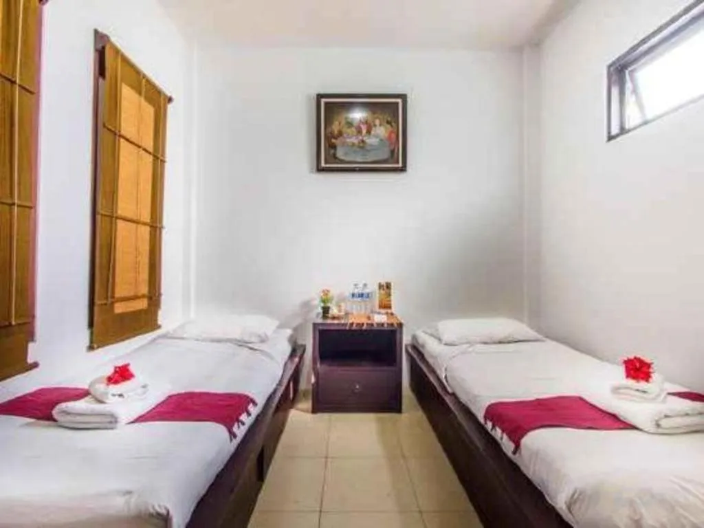 Bed in Al-Isha Dharamshala