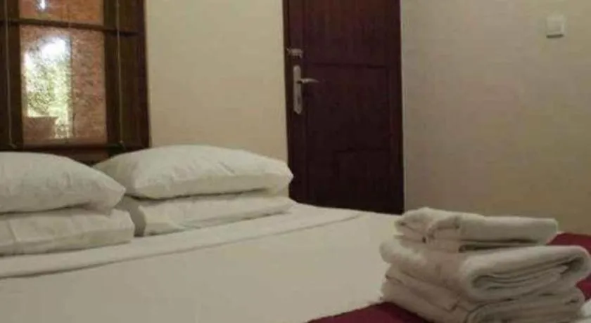 Bed in Al-Isha Dharamshala