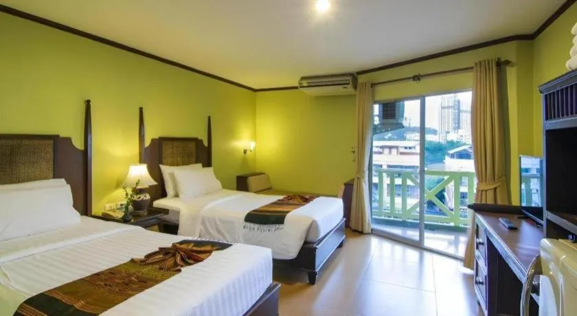 Bed in Phuphaya Resort Pattaya