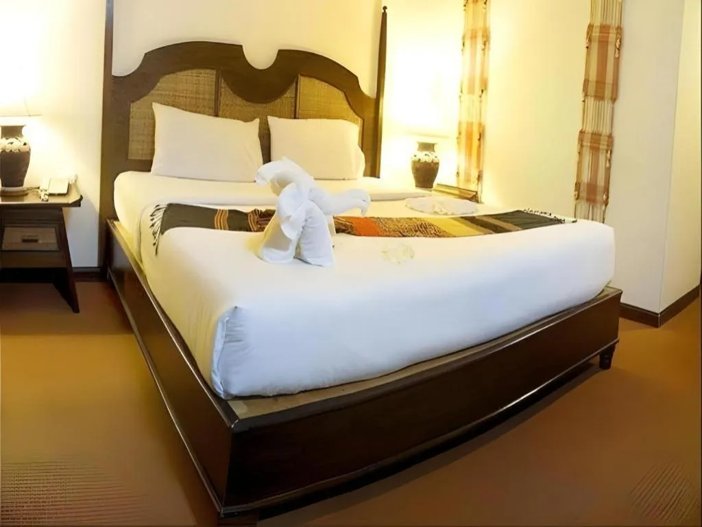 Bed in Phuphaya Resort Pattaya