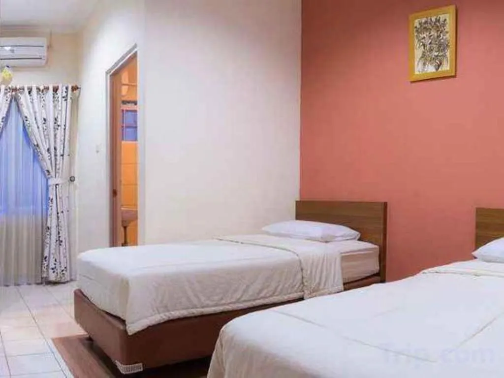 Bed in Lotus Bandung Hotel, Cafe, and Meeting Place