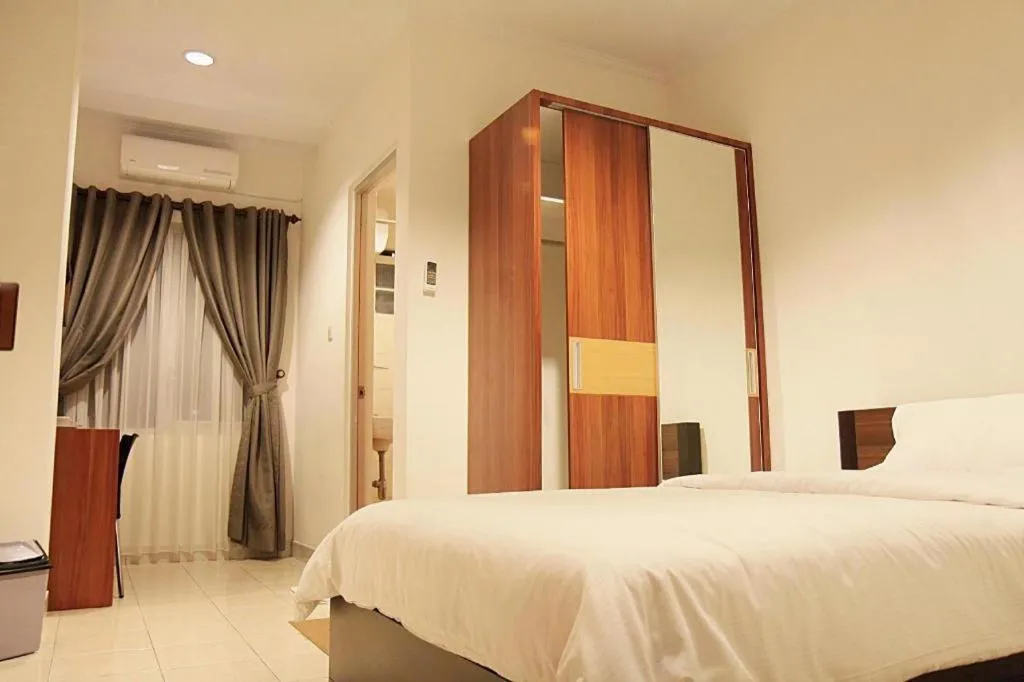 Bed in Lotus Bandung Hotel, Cafe, and Meeting Place