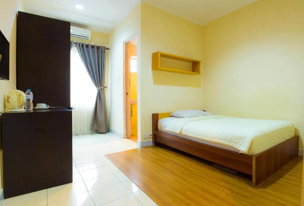 Bed in Lotus Bandung Hotel, Cafe, and Meeting Place