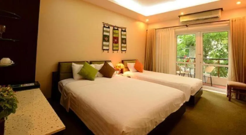 Bed in Artisan Boutique Hotel