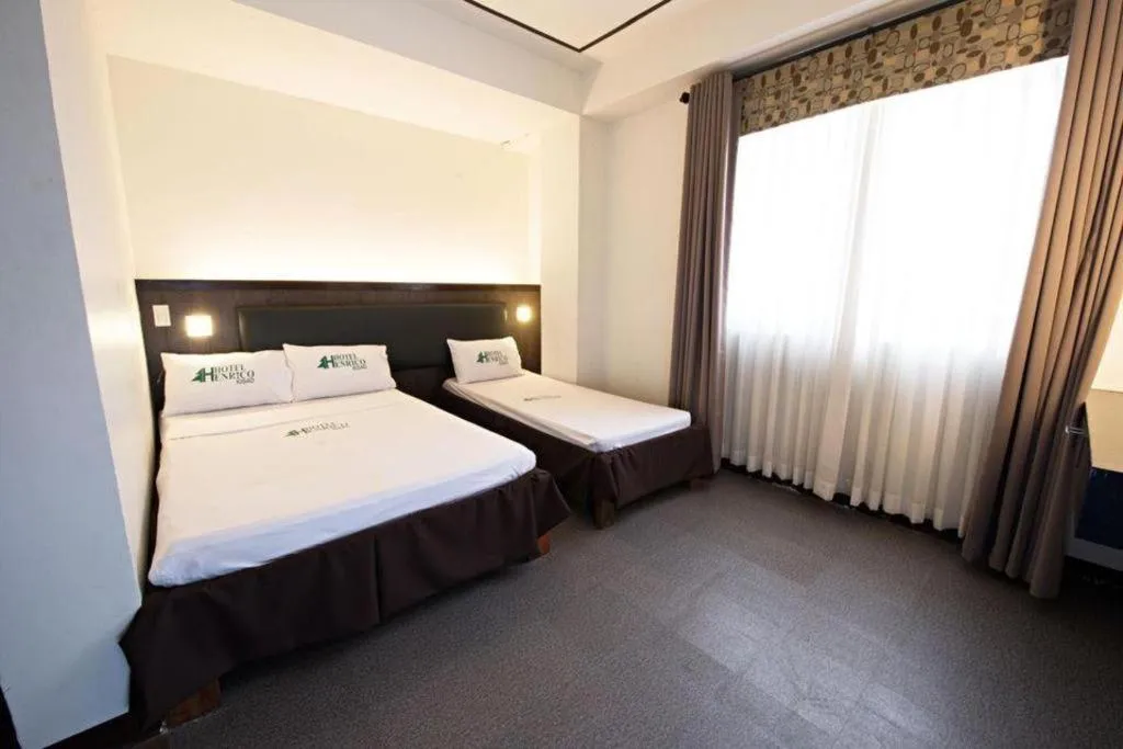 Bed in Hotel Henrico Kisad