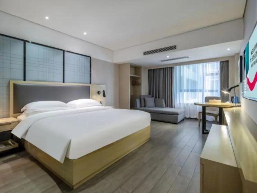 Bed in Echarm Hotel Beihai Railway Station