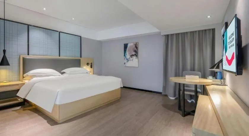 Bed in Echarm Hotel Beihai Railway Station