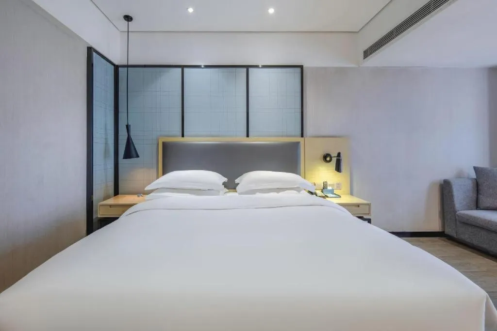 Bed in Echarm Hotel Beihai Railway Station