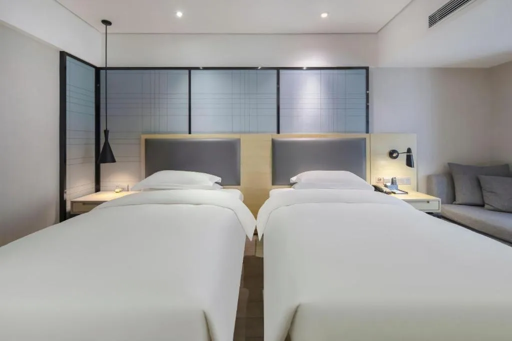 Bed in Echarm Hotel Beihai Railway Station