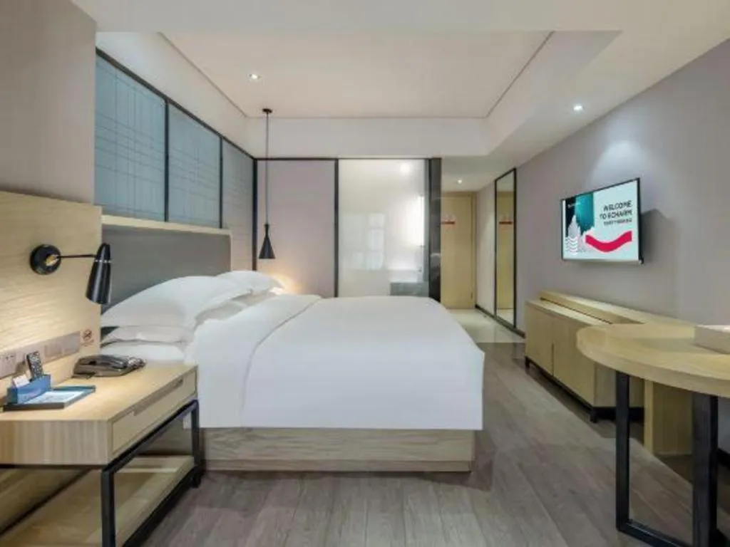 Bed in Echarm Hotel Beihai Railway Station