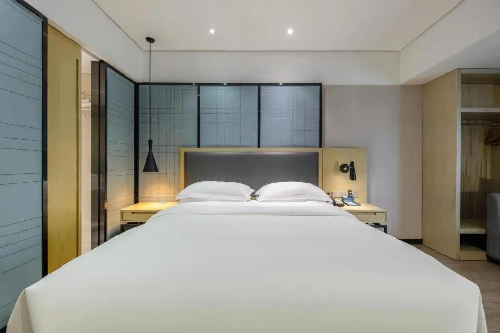 Bed in Echarm Hotel Beihai Railway Station