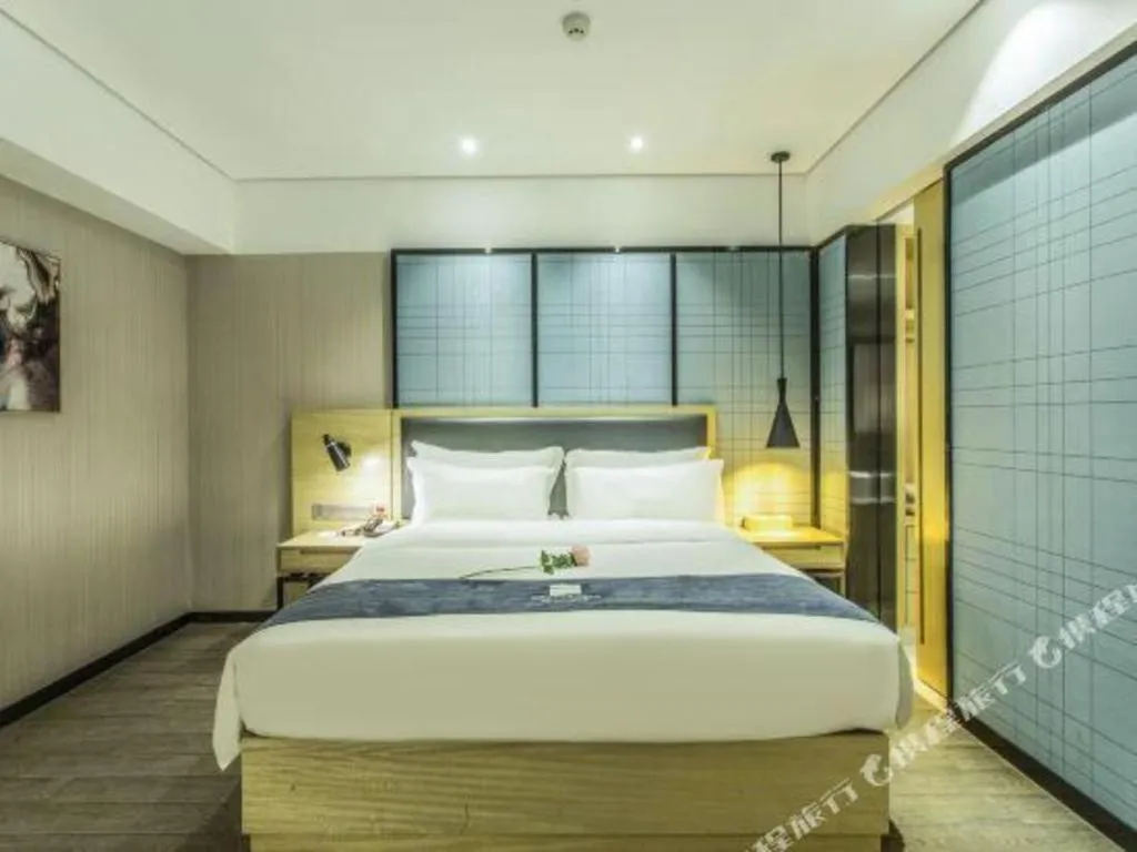 Bed in Echarm Hotel Beihai Railway Station