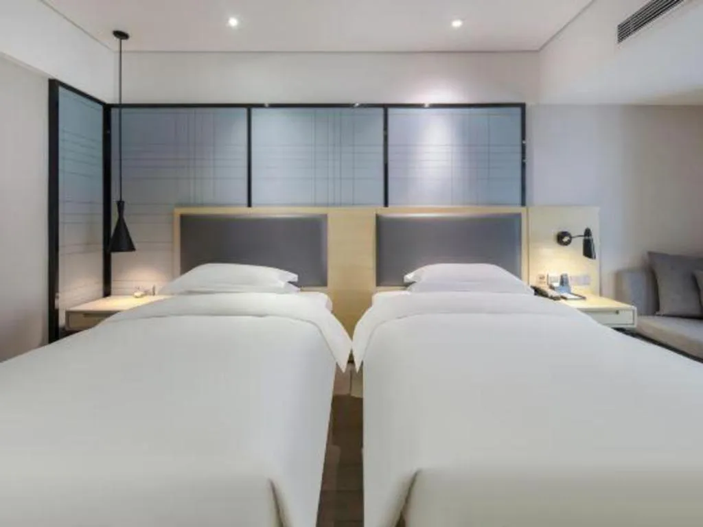 Bed in Echarm Hotel Beihai Railway Station