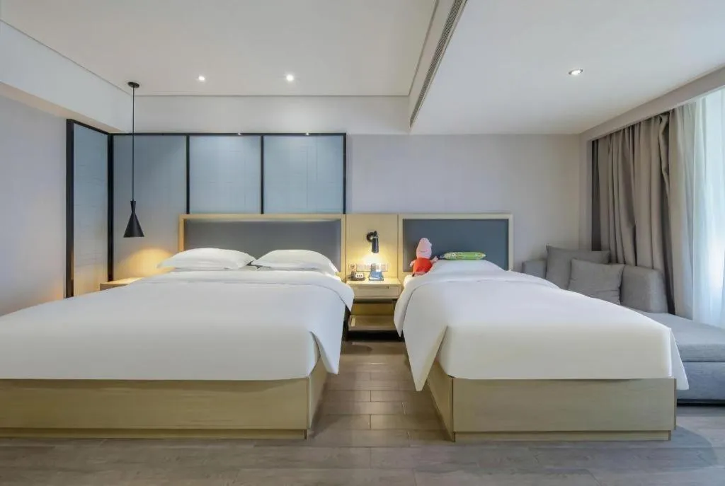 Bed in Echarm Hotel Beihai Railway Station