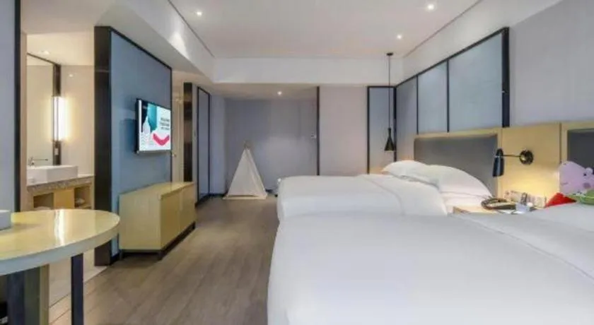 Bed in Echarm Hotel Beihai Railway Station