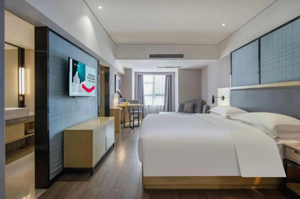 Bed in Echarm Hotel Beihai Railway Station