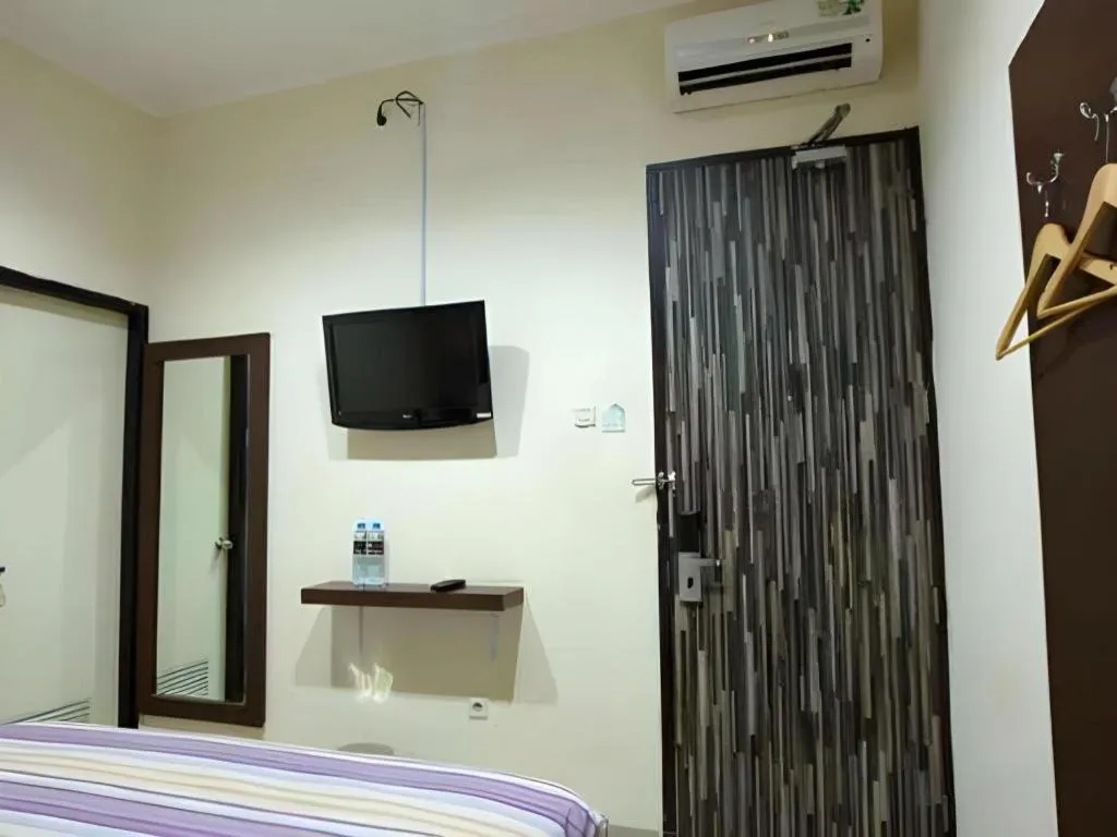 Bed in Vindhika Hotel