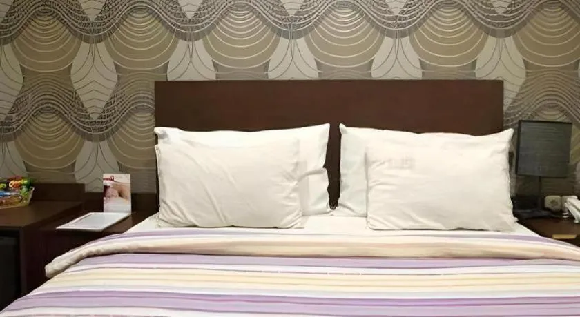 Bed in Vindhika Hotel