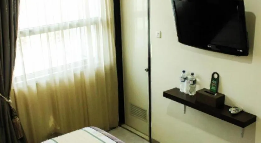 Bed in Vindhika Hotel