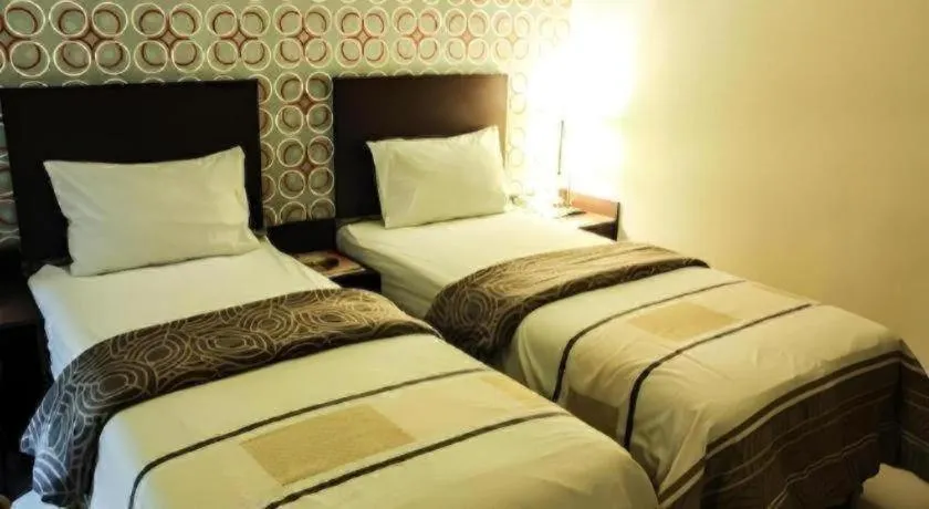 Bed in Vindhika Hotel