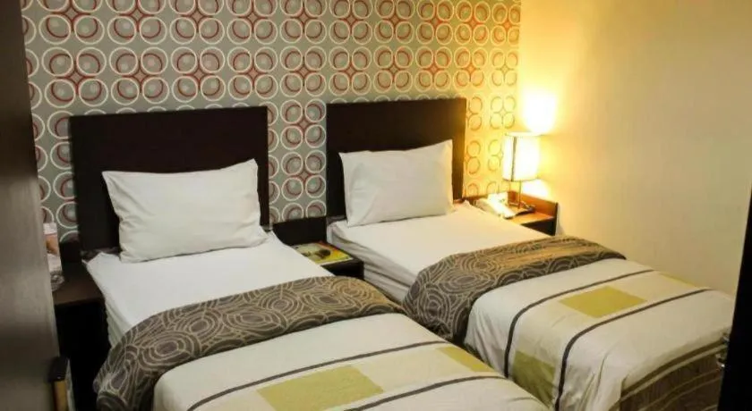 Bed in Vindhika Hotel