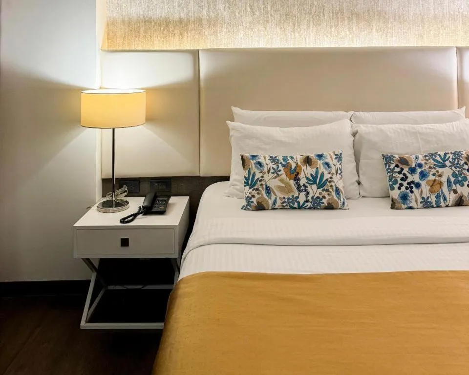 Bed in Home Crest Hotel