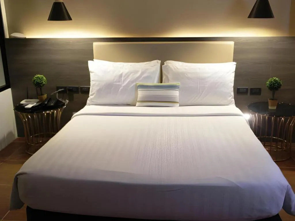 Bed in Home Crest Hotel