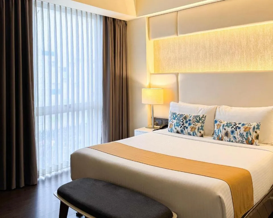 Bed in Home Crest Hotel