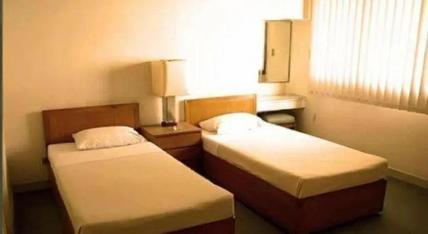 Bed in Amorsolo Mansion Hotel