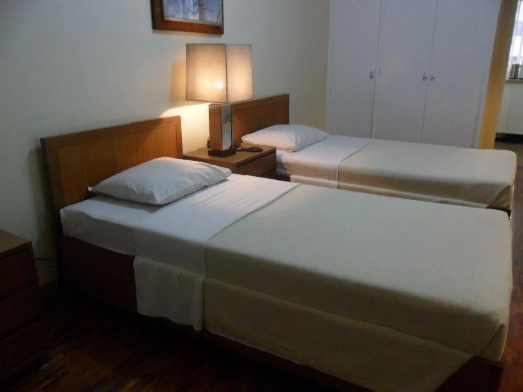 Bed in Amorsolo Mansion Hotel