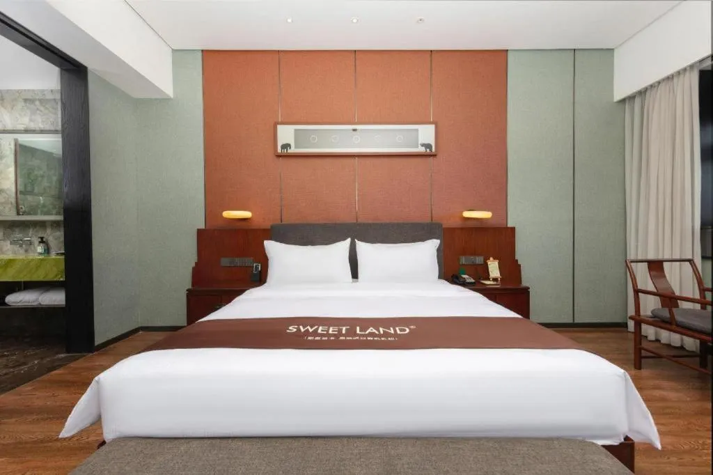 Bed in Rezen Hotel Pasonda Junyu