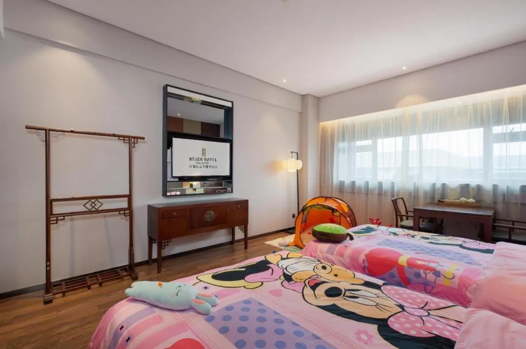 Bed in Rezen Hotel Pasonda Junyu