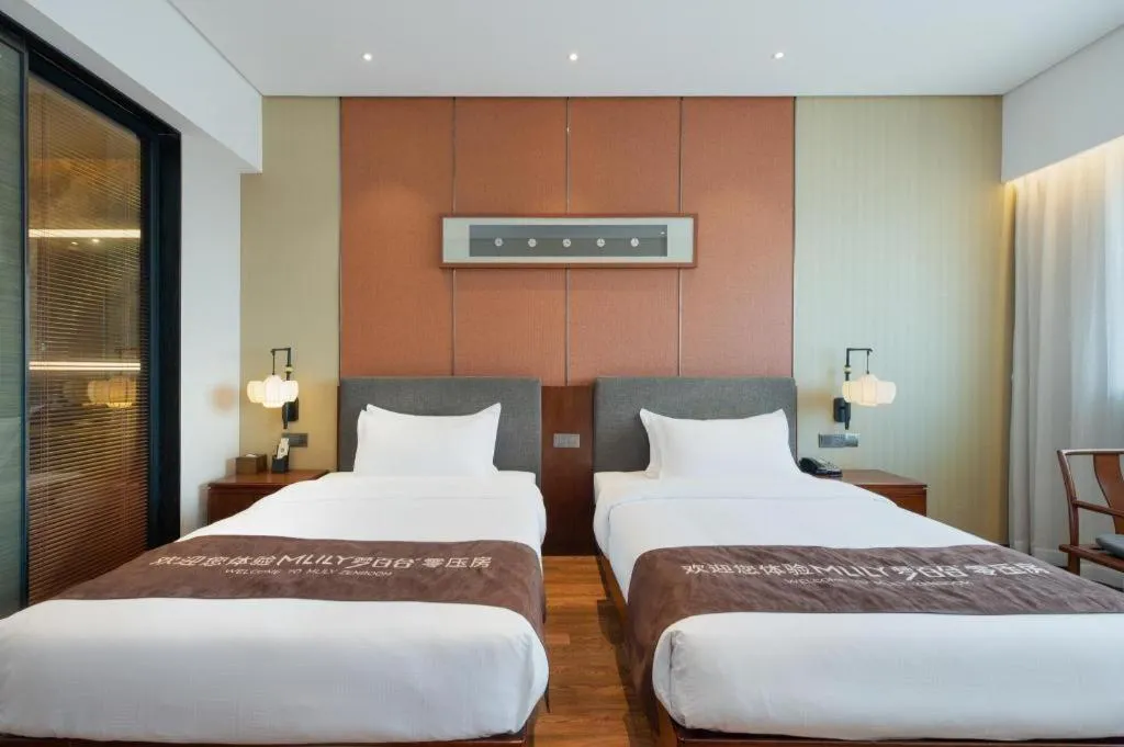 Bed in Rezen Hotel Pasonda Junyu