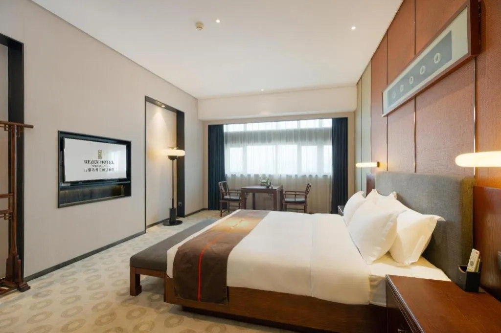 Bed in Rezen Hotel Pasonda Junyu