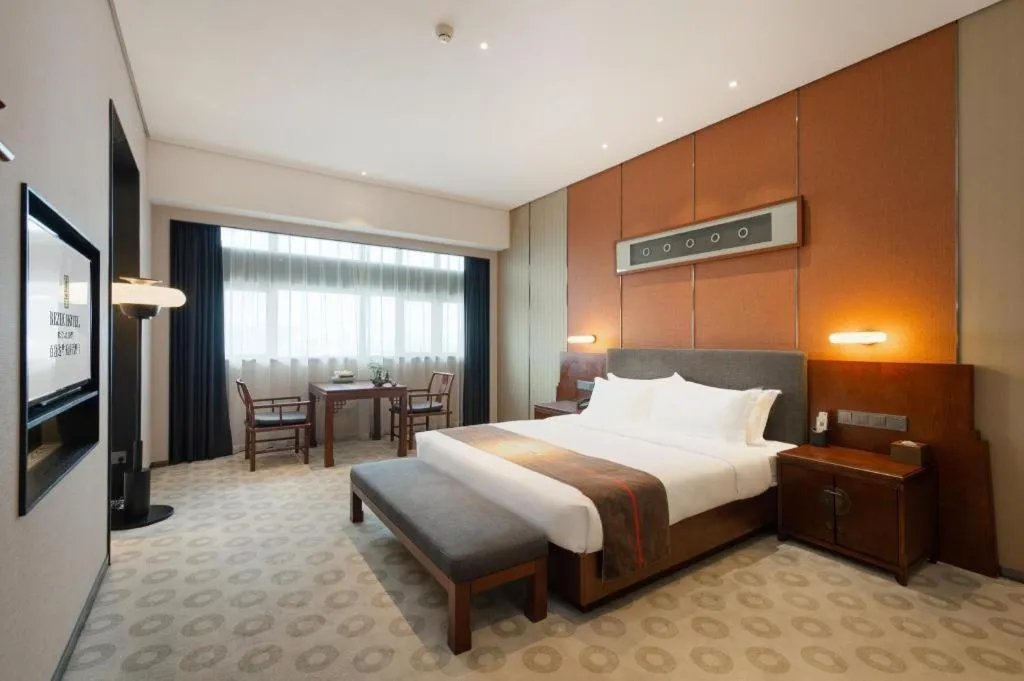 Bed in Rezen Hotel Pasonda Junyu