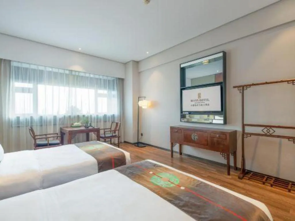 Bed in Rezen Hotel Pasonda Junyu