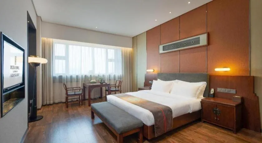 Bed in Rezen Hotel Pasonda Junyu