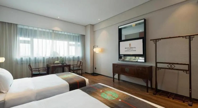 Bed in Rezen Hotel Pasonda Junyu