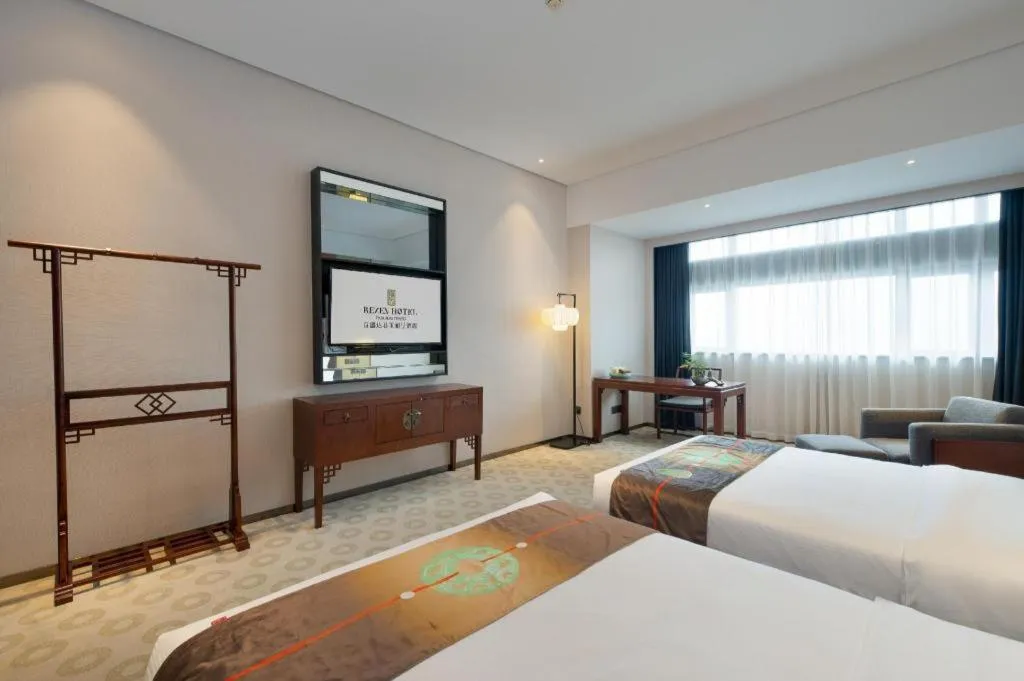 Bed in Rezen Hotel Pasonda Junyu