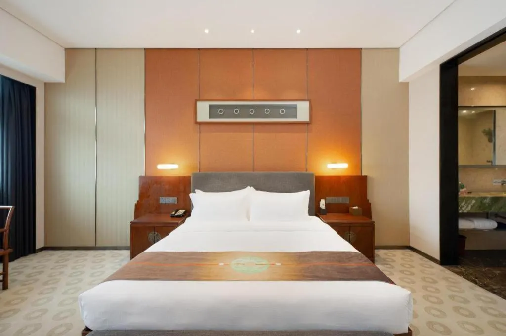 Bed in Rezen Hotel Pasonda Junyu