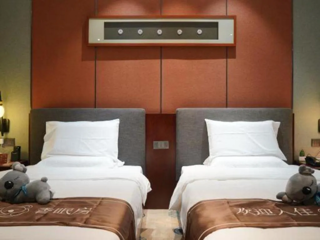 Bed in Rezen Hotel Pasonda Junyu