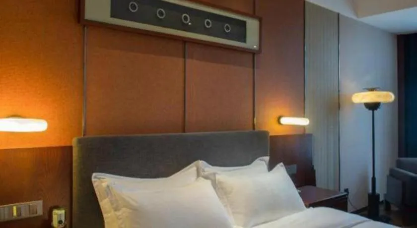 Bed in Rezen Hotel Pasonda Junyu