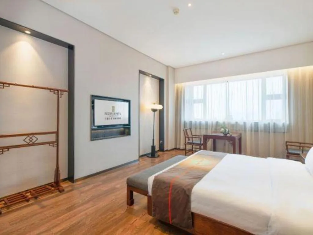 Bed in Rezen Hotel Pasonda Junyu