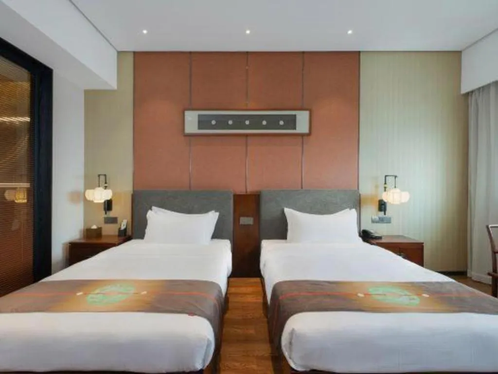 Bed in Rezen Hotel Pasonda Junyu