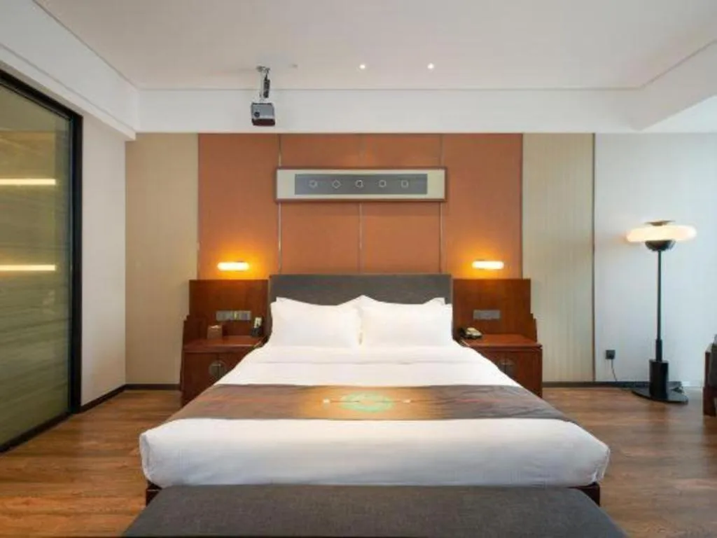 Bed in Rezen Hotel Pasonda Junyu