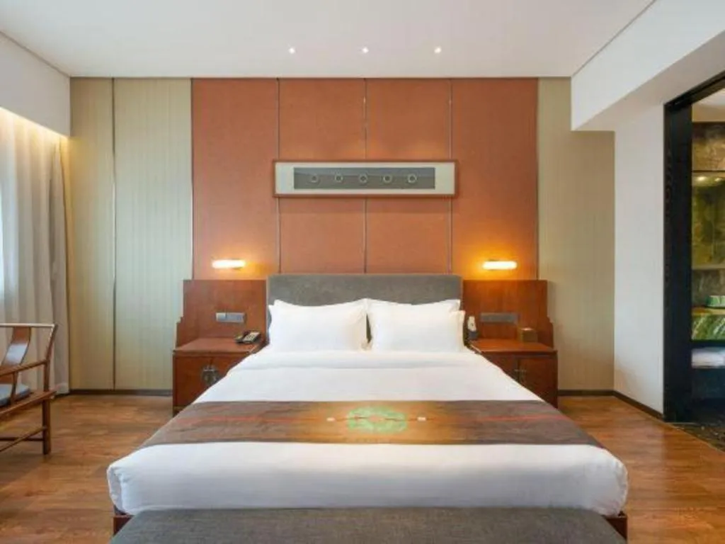 Bed in Rezen Hotel Pasonda Junyu